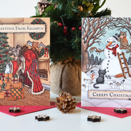 Griezelige Kerstkaarten Set x 6 Zes Monster en Katten Wenskaarten Krampus Enge Sneeuwman Gothic Kerstmis Poezen Illustraties Spooky Folklore Kerstkaart Creepy Christmas Felicitatie Feestdagen Kaart